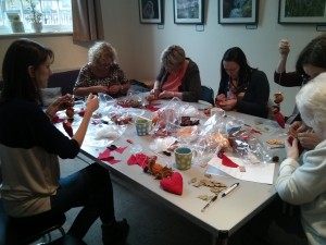 people doing christmas-themed crafts